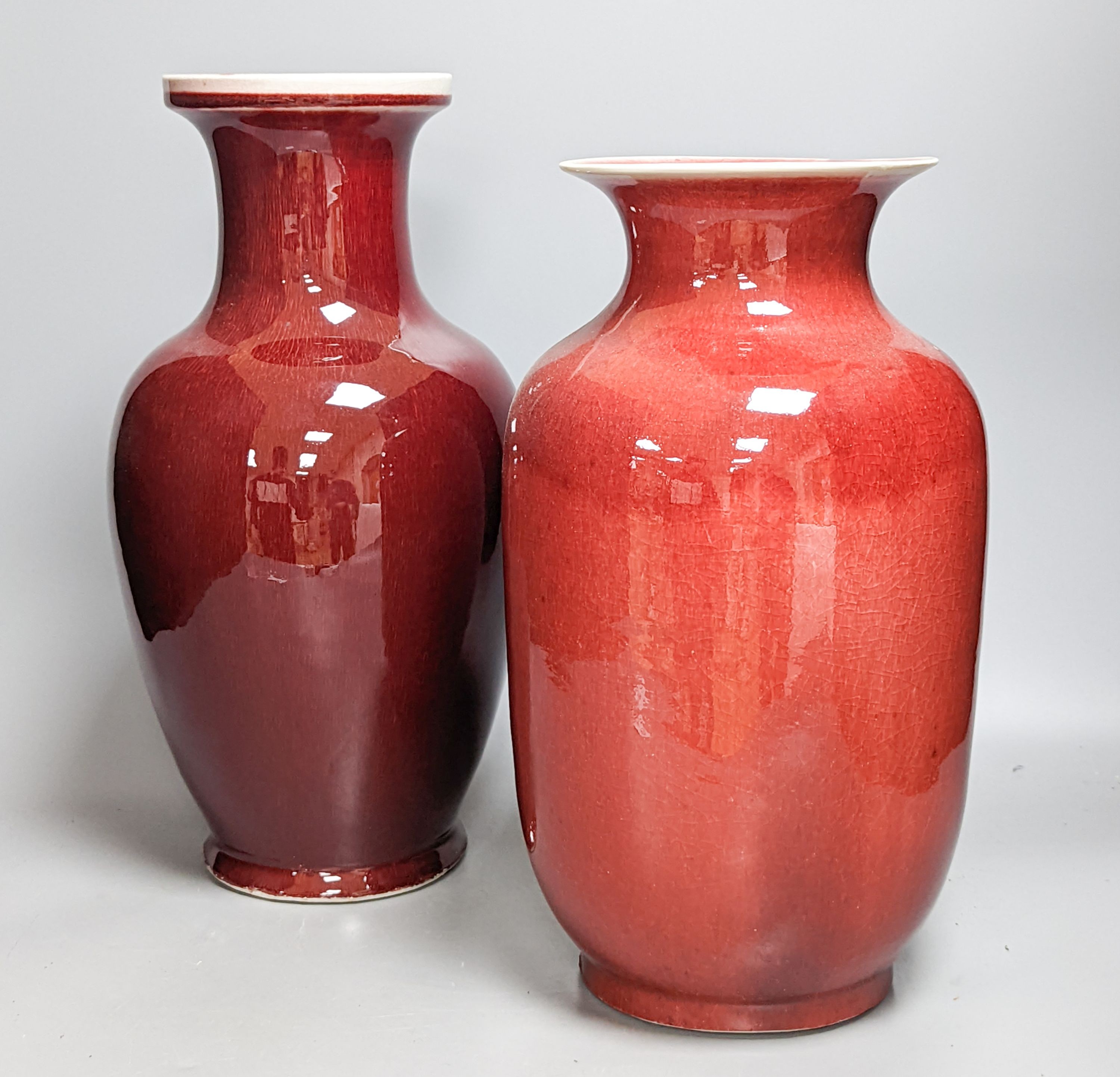 Two large Chinese sang de boeuf glazed vases tallest 36cm